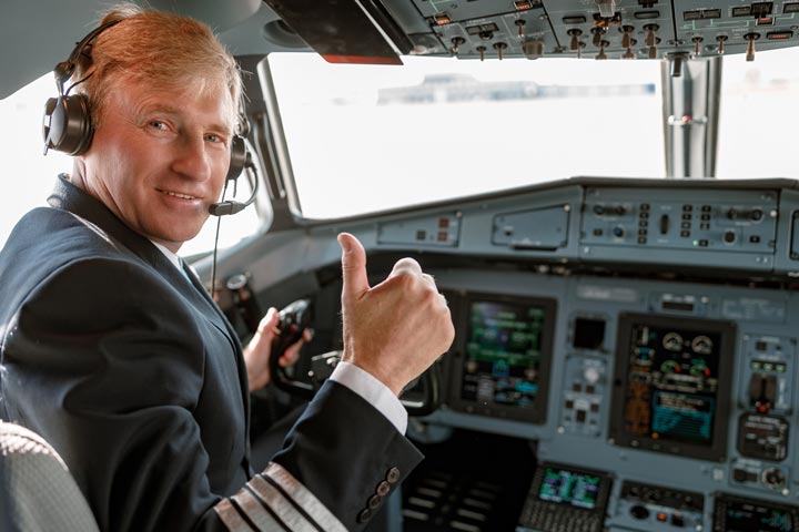 Pilot giving thumbs up to income protection insurance