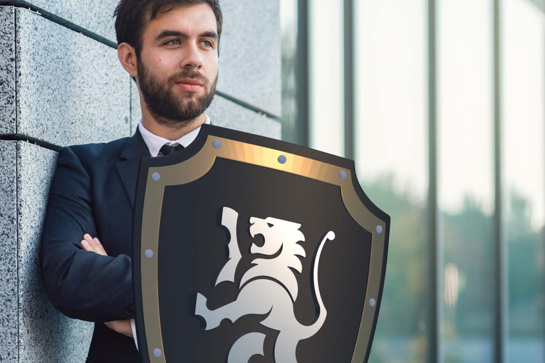 Business Man with Black Lion Insurance Shield